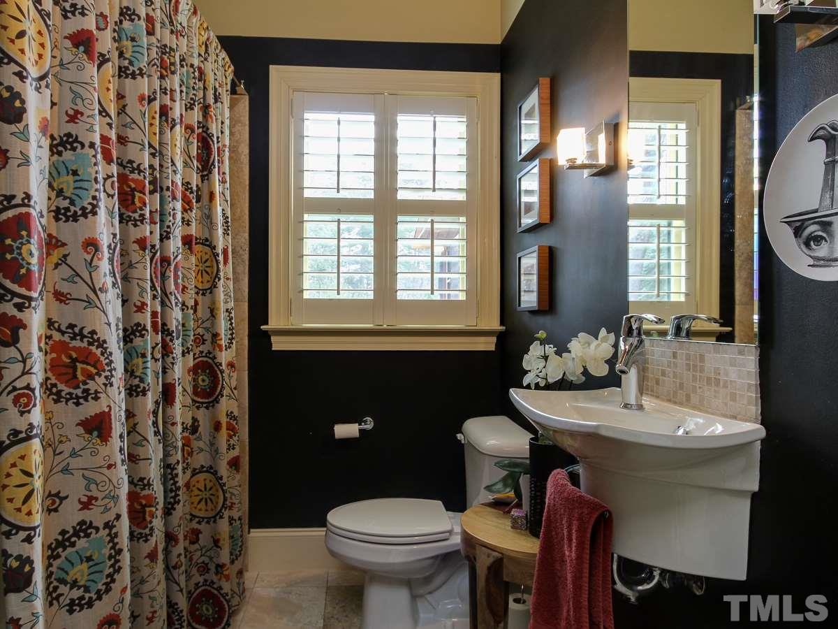 2711 Barmettler Street Raleigh, NC 27607 - Photo 14 of 25 a bathroom with a sink and a toilet