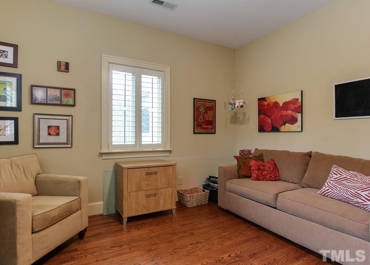 2711 Barmettler Street Raleigh, NC 27607 - Photo 15 of 25 a living room with furniture and a window
