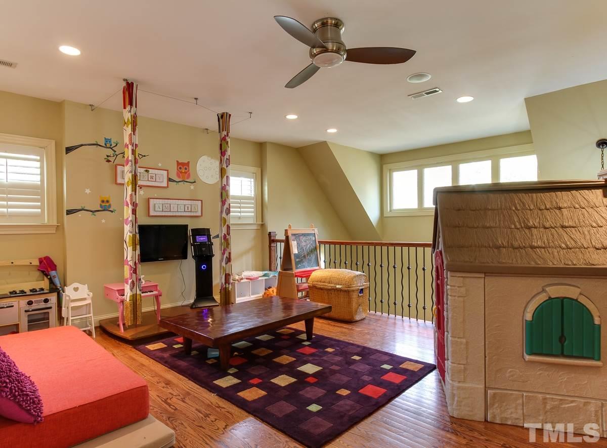 2711 Barmettler Street Raleigh, NC 27607 - Photo 20 of 25 a room with wooden floor pool table and stainless steel appliances