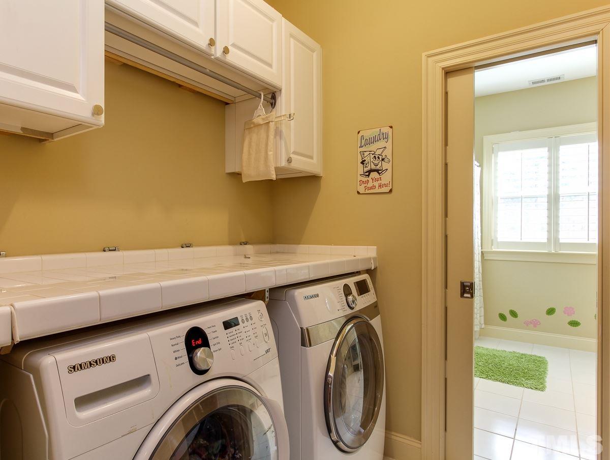 2711 Barmettler Street Raleigh, NC 27607 - Photo 23 of 25 a utility room with dryer and washer