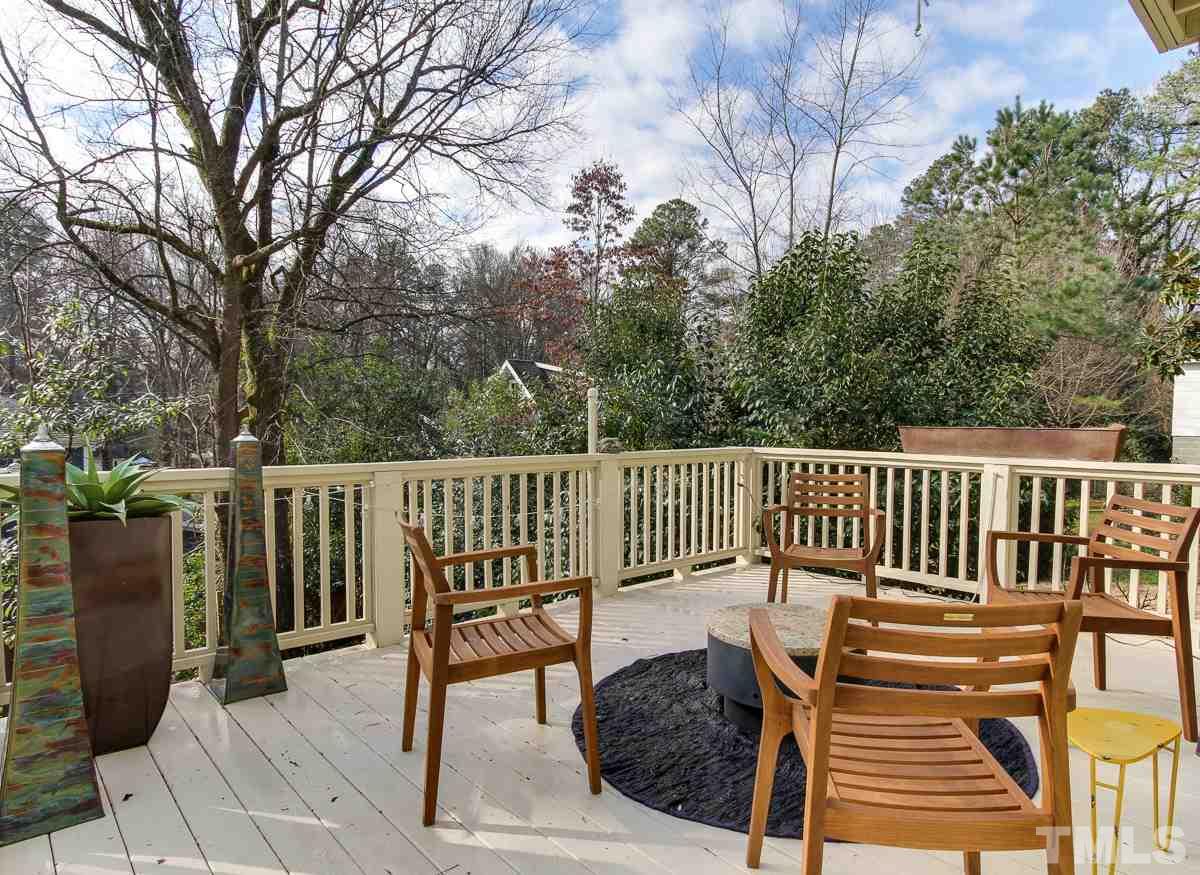 2711 Barmettler Street Raleigh, NC 27607 - Photo 24 of 25 a view of a wooden deck with a bench