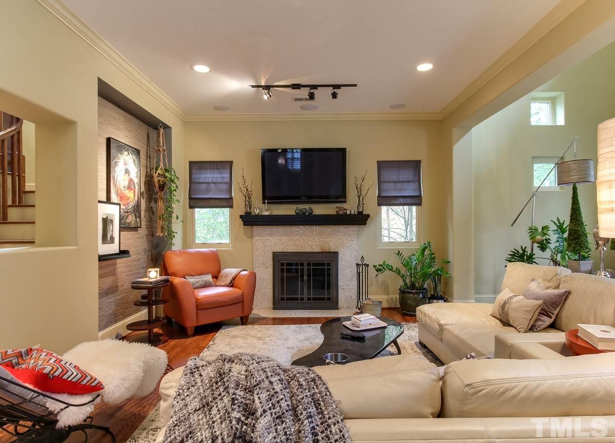 2711 Barmettler Street Raleigh, NC 27607 - Photo 5 of 25 a living room with furniture and a fireplace