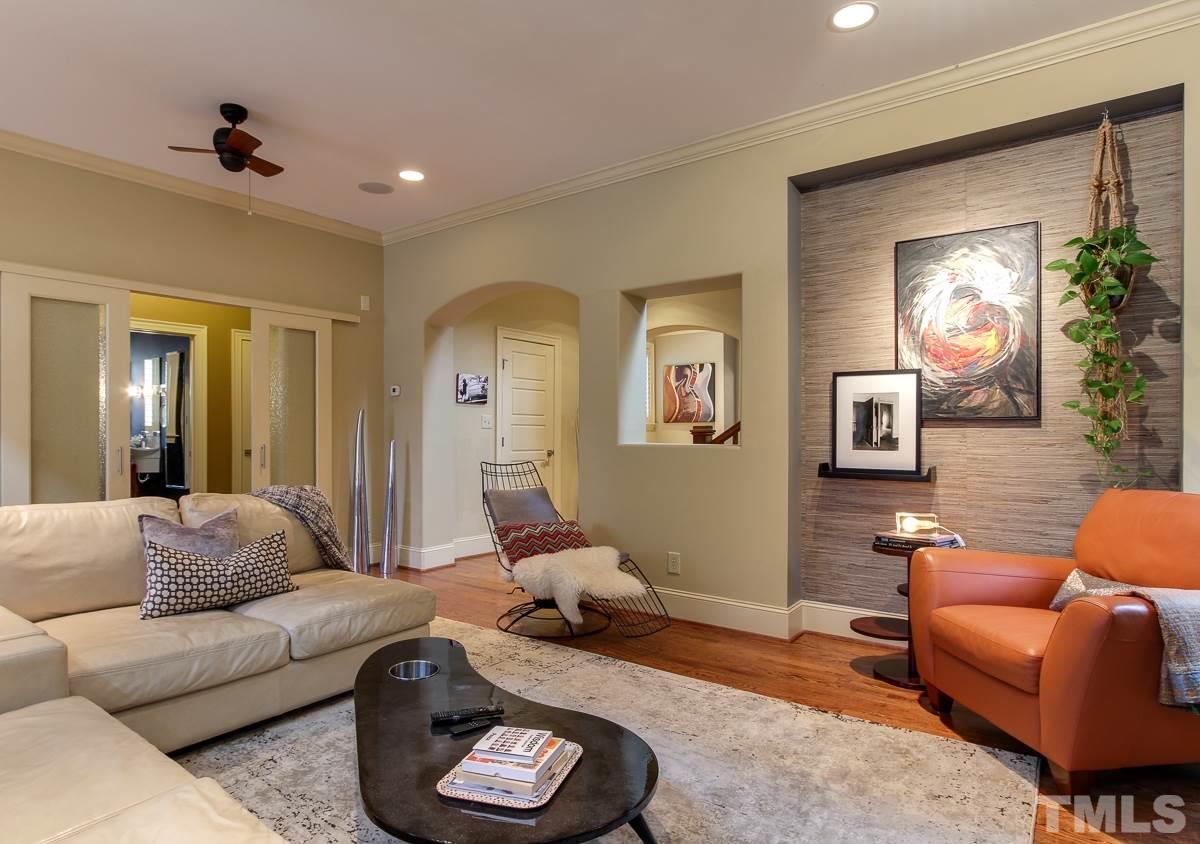 2711 Barmettler Street Raleigh, NC 27607 - Photo 6 of 25 a living room with furniture and a mirror