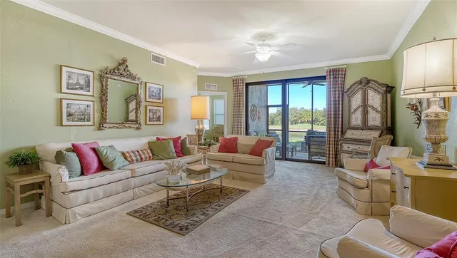 a dining room with furniture a chandelier and window