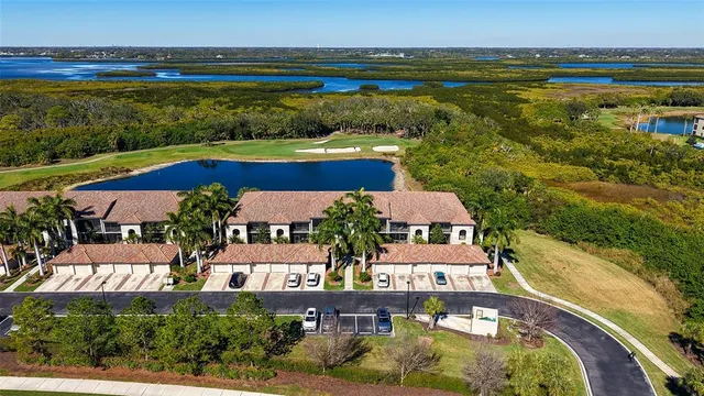 an aerial view of house with yard swimming pool and outdoor seating
