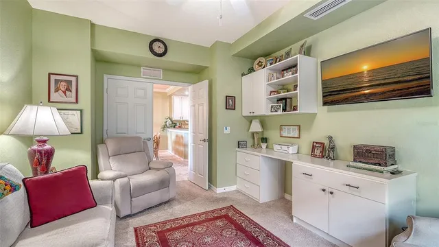 a view of a lake with a yard and trees