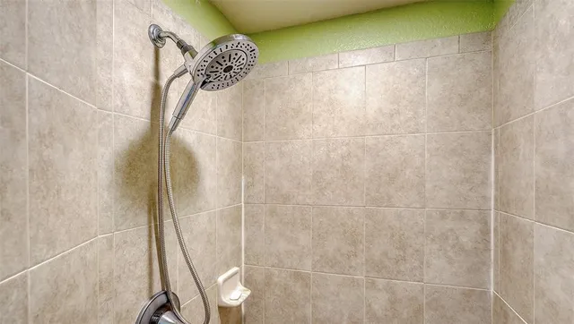 an aerial view of a swimming pool a yard and mountain view in back