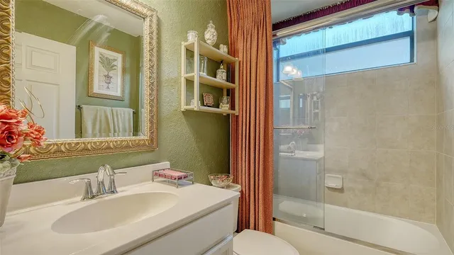 a front view of multi story residential apartment building with a yard