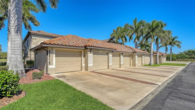 a kitchen with granite countertop wooden cabinets stainless steel appliances a sink and a window