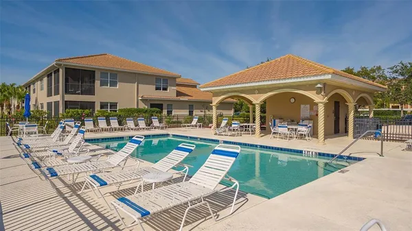 a view of a swimming pool with a slide and a lake view