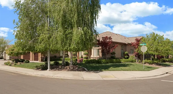 front view of a house with a garden