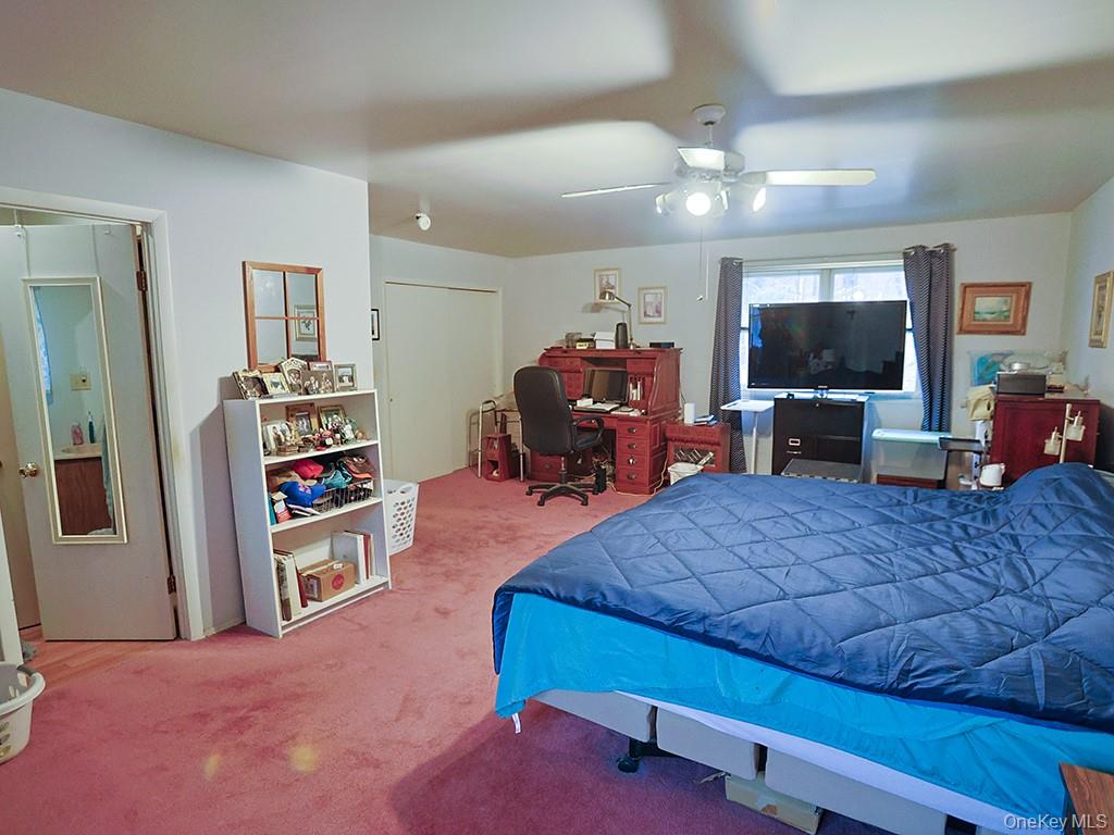 68 Kennel Road Cuddebackville, NY 12729 - Photo 20 of 21 a living room with furniture and a flat screen tv