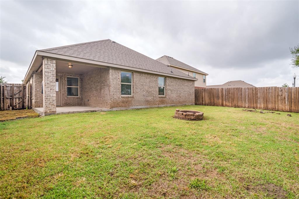 3415 Emerson Road Forney, TX 75126 - Photo 25 of 26 a swimming pool with outdoor seating and yard