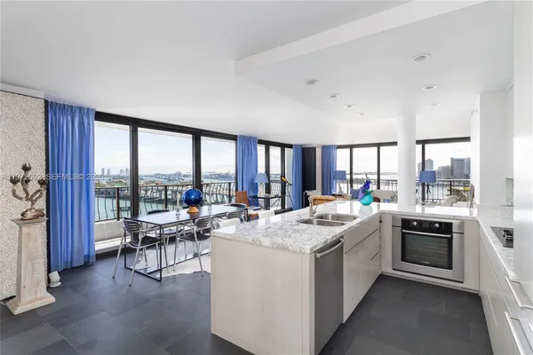 a room with sink washer and dryer
