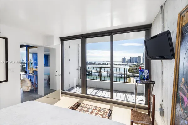 a living room filled with furniture and a flat screen tv