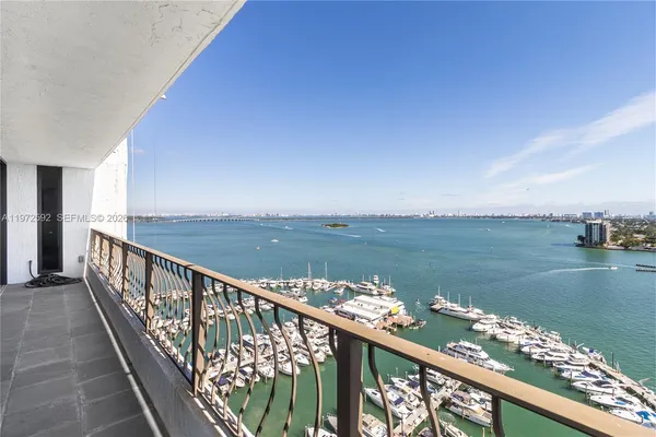 a view of a balcony next to a lake