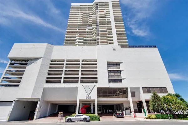 a front view of a building with glass windows