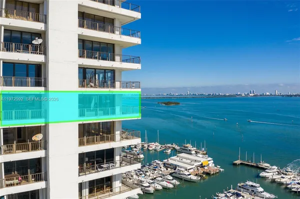 a front view of a building with an outdoor space and seating