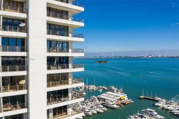 a room with a book shelf and a wooden floor