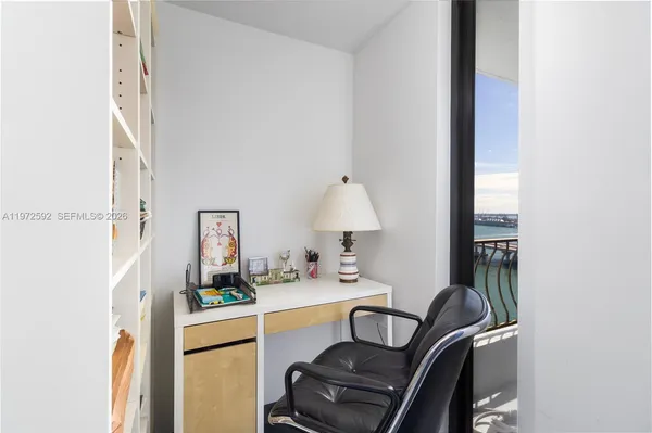 a work place with furniture and wooden floor