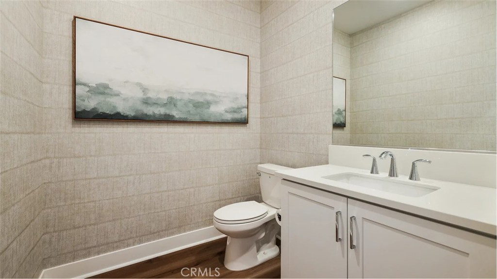 1803 Lychee Street Fullerton, CA 92833 - Photo 10 of 23 a bathroom with a toilet a sink and mirror