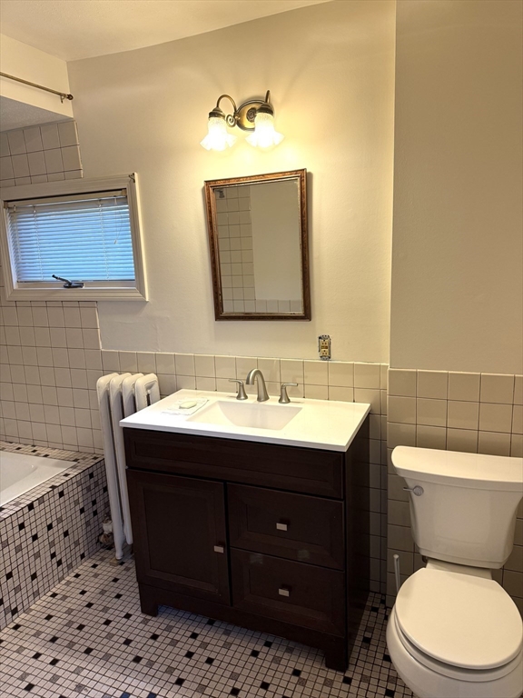 21 Westford Circle Springfield, MA 01109 - Photo 14 of 24 a bathroom with a toilet sink vanity and mirror