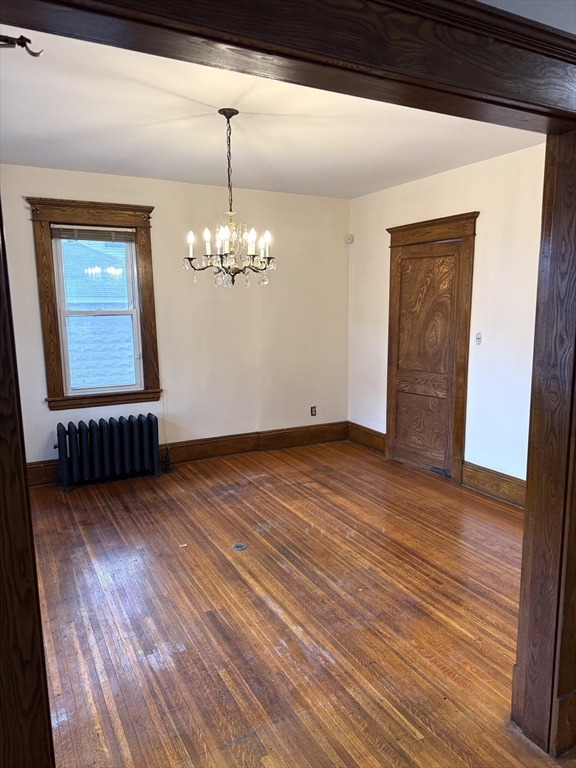 21 Westford Circle Springfield, MA 01109 - Photo 14 of 25 a view of an empty room with wooden floor and a window