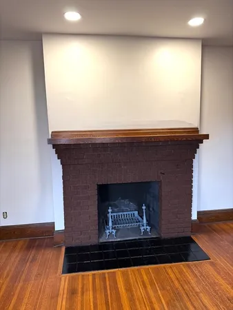 a view of fireplace and wooden floor