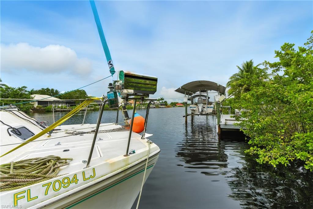 176 Venus Cay Naples, FL 34114 - Photo 4 of 50 Dock with a water view and boat lift