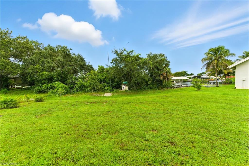 176 Venus Cay Naples, FL 34114 - Photo 48 of 50 View of grassy yard
