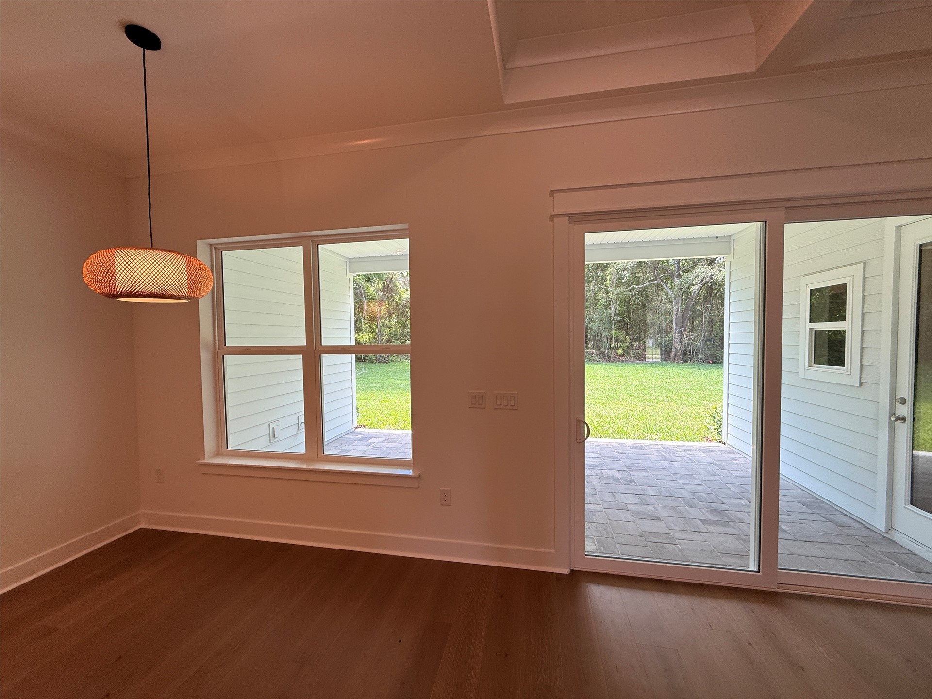 96130 Captains Pointe Road Yulee, FL 32097 - Photo 11 of 32 a view of an empty room with a window and wooden floor