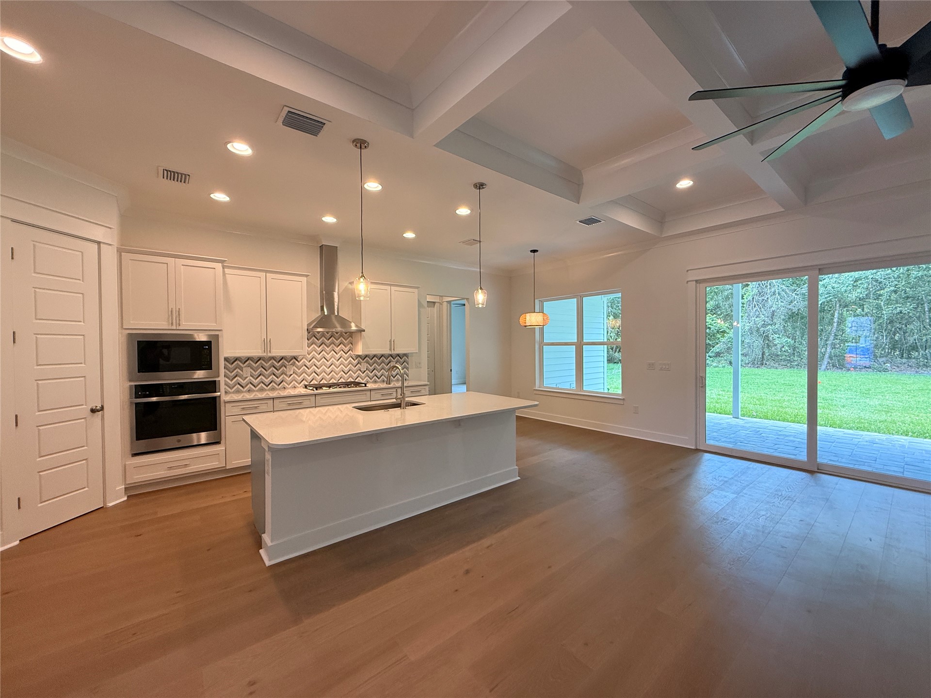 96130 Captains Pointe Road Yulee, FL 32097 - Photo 12 of 32 a large kitchen with stainless steel appliances granite countertop a large counter top a stove and a refrigerator