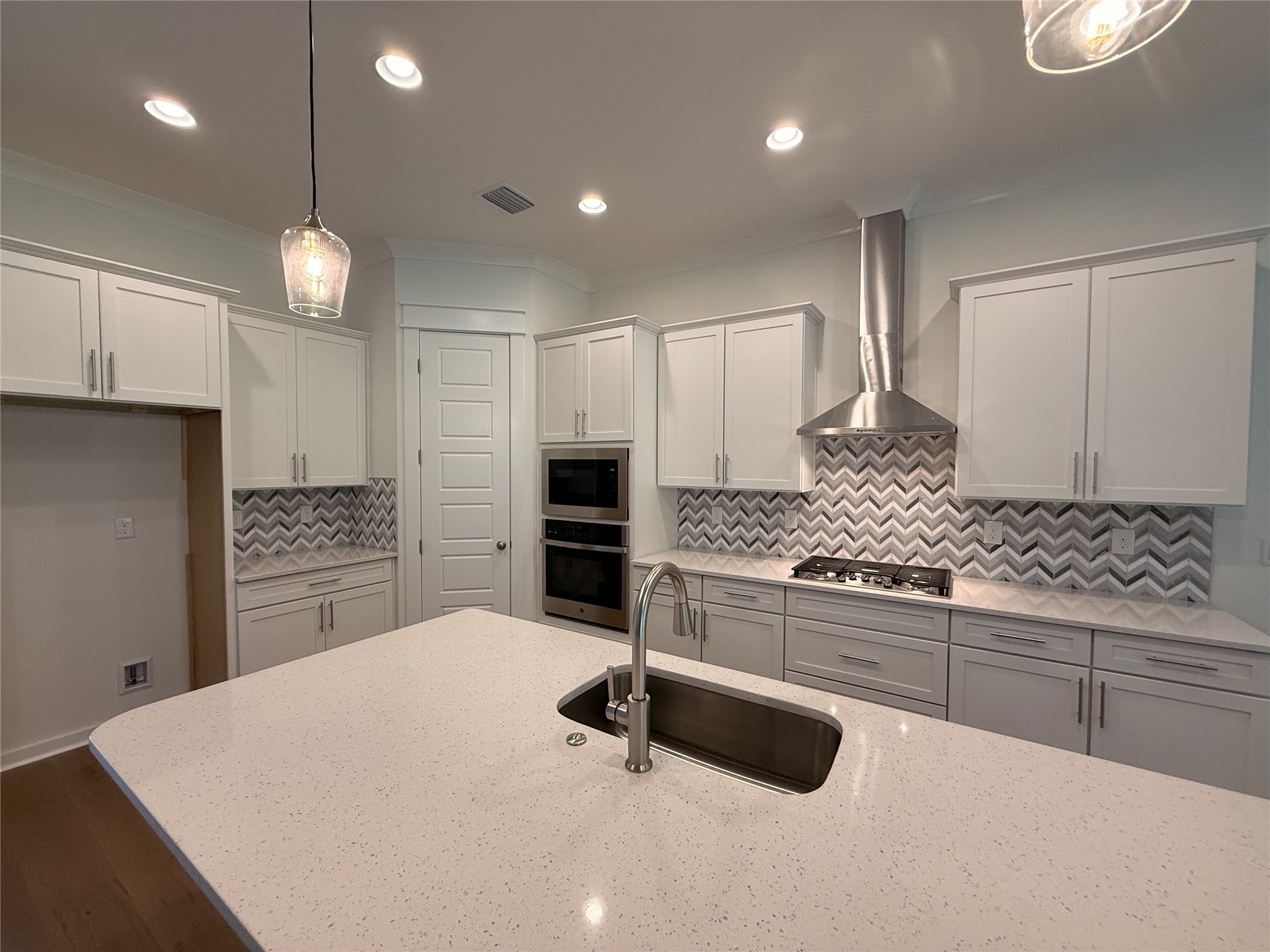 96130 Captains Pointe Road Yulee, FL 32097 - Photo 13 of 32 a kitchen with granite countertop a stove a sink cabinets and a refrigerator