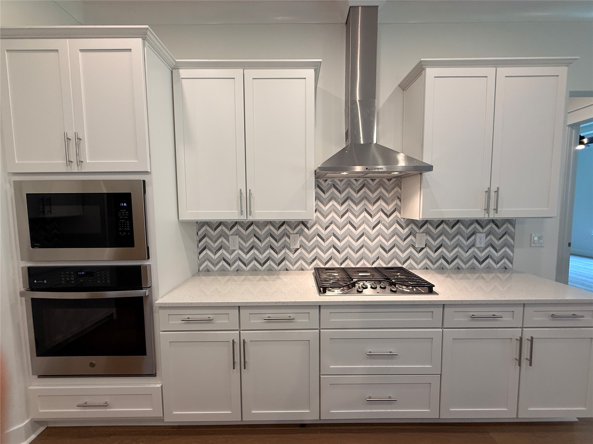 96130 Captains Pointe Road Yulee, FL 32097 - Photo 14 of 32 a kitchen with white cabinets and appliances