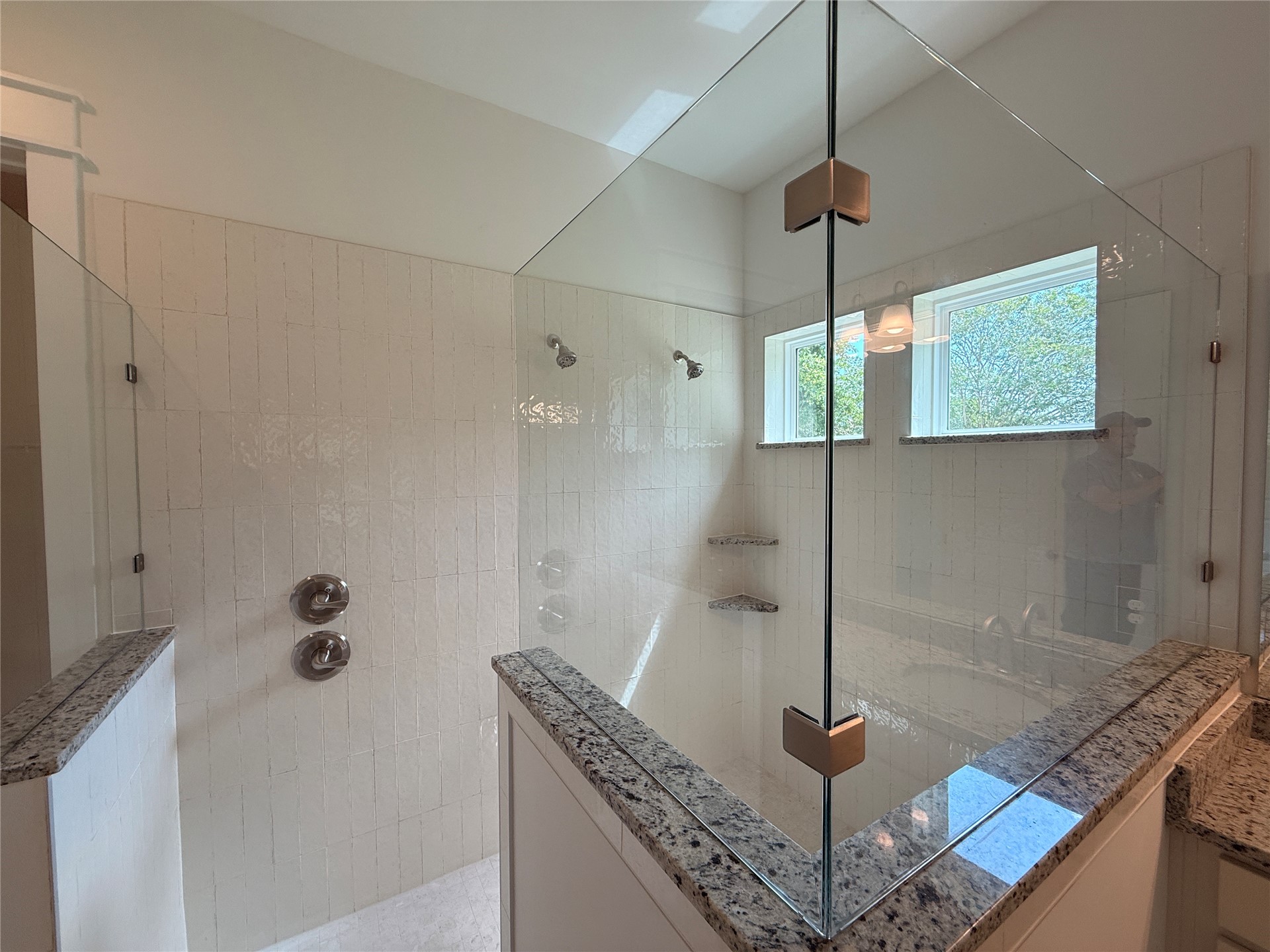 96130 Captains Pointe Road Yulee, FL 32097 - Photo 18 of 32 a bathroom with a granite countertop sink a mirror and shower