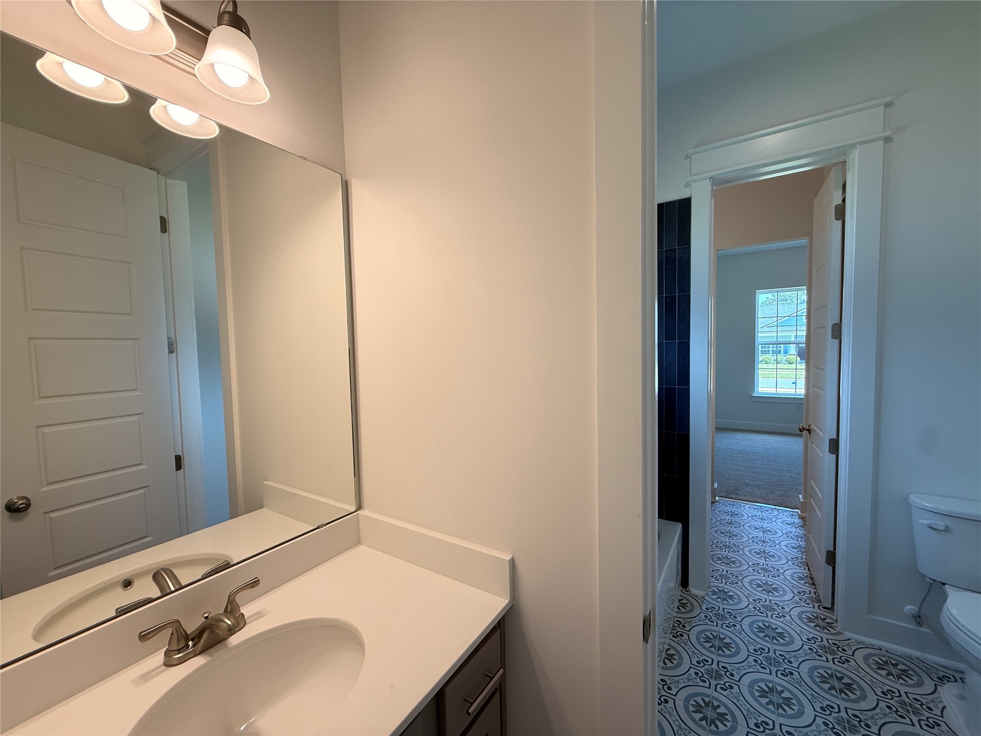 96130 Captains Pointe Road Yulee, FL 32097 - Photo 21 of 32 a bathroom with a sink and a mirror