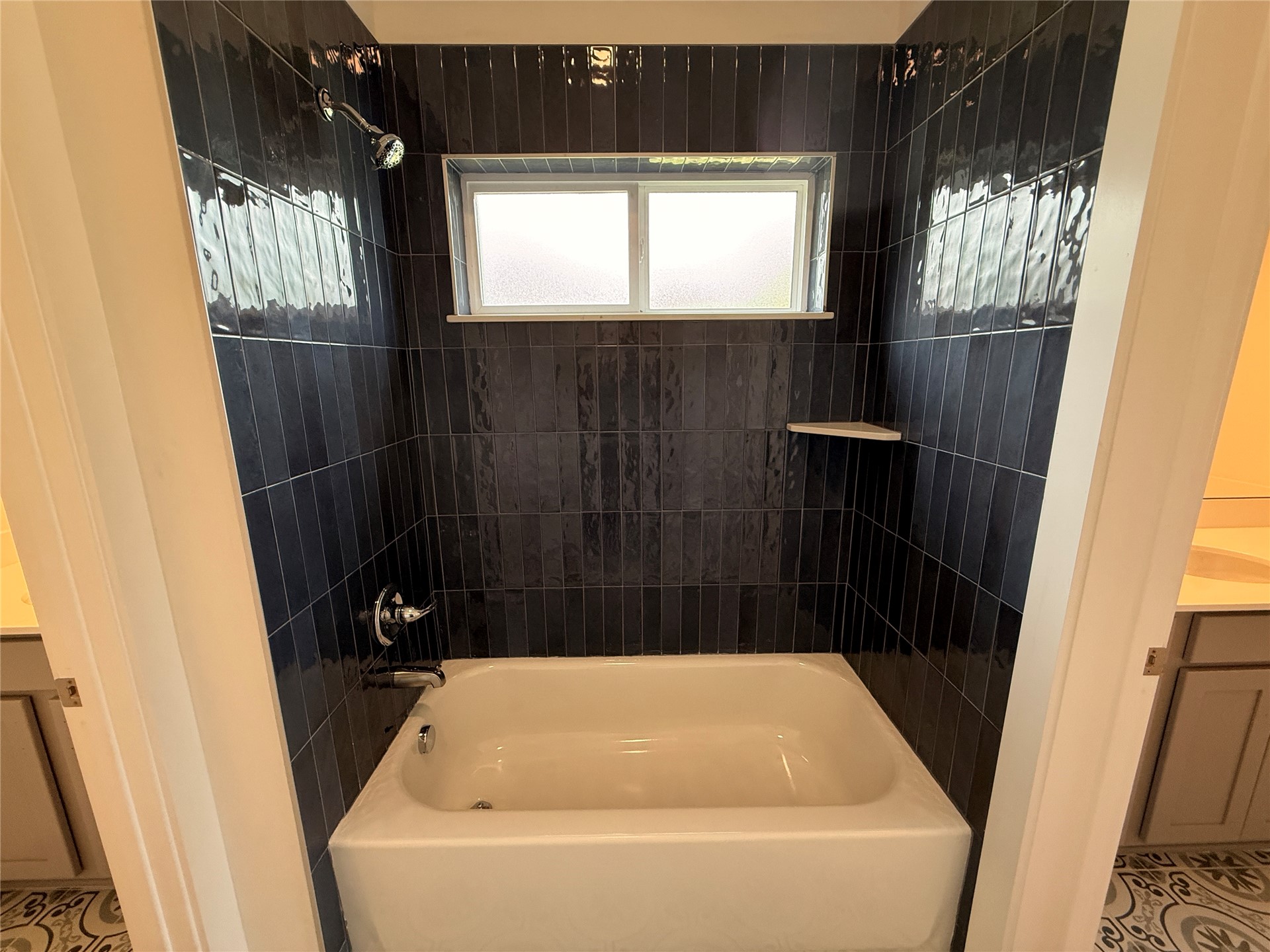 96130 Captains Pointe Road Yulee, FL 32097 - Photo 22 of 32 a bathroom with a bathtub and window