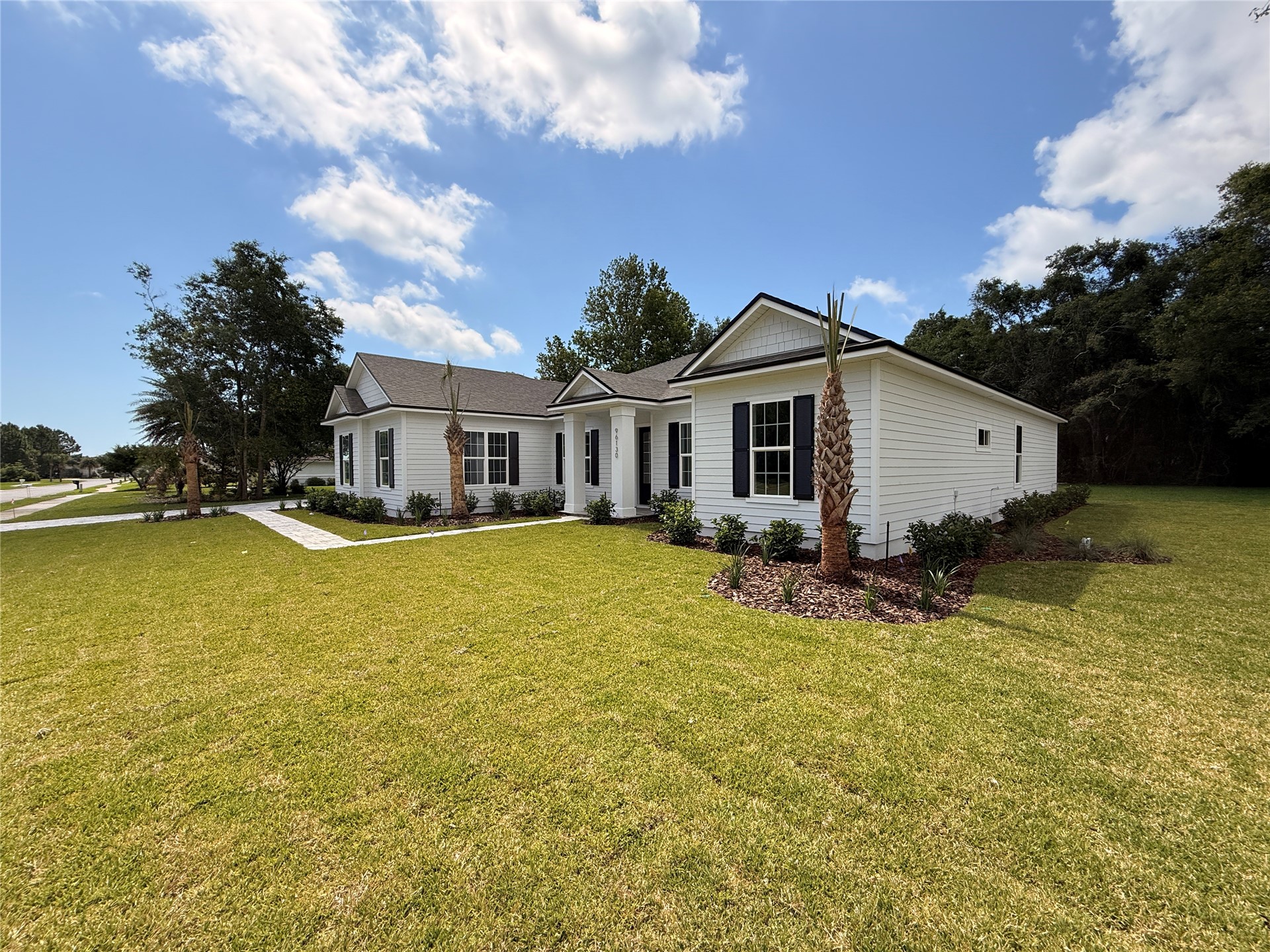 96130 Captains Pointe Road Yulee, FL 32097 - Photo 3 of 32 a view of a house with pool and a yard