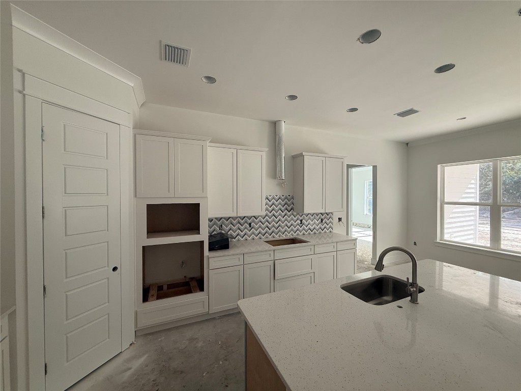 96130 Captains Pointe Road Yulee, FL 32097 - Photo 5 of 12 a kitchen with stainless steel appliances a stove microwave and sink