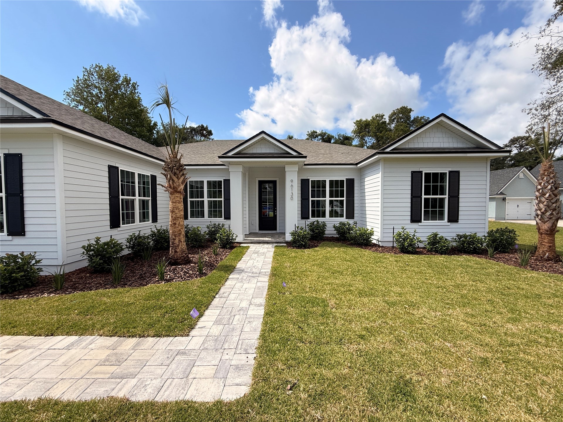 96130 Captains Pointe Road Yulee, FL 32097 - Photo 6 of 32 a front view of a house with a yard