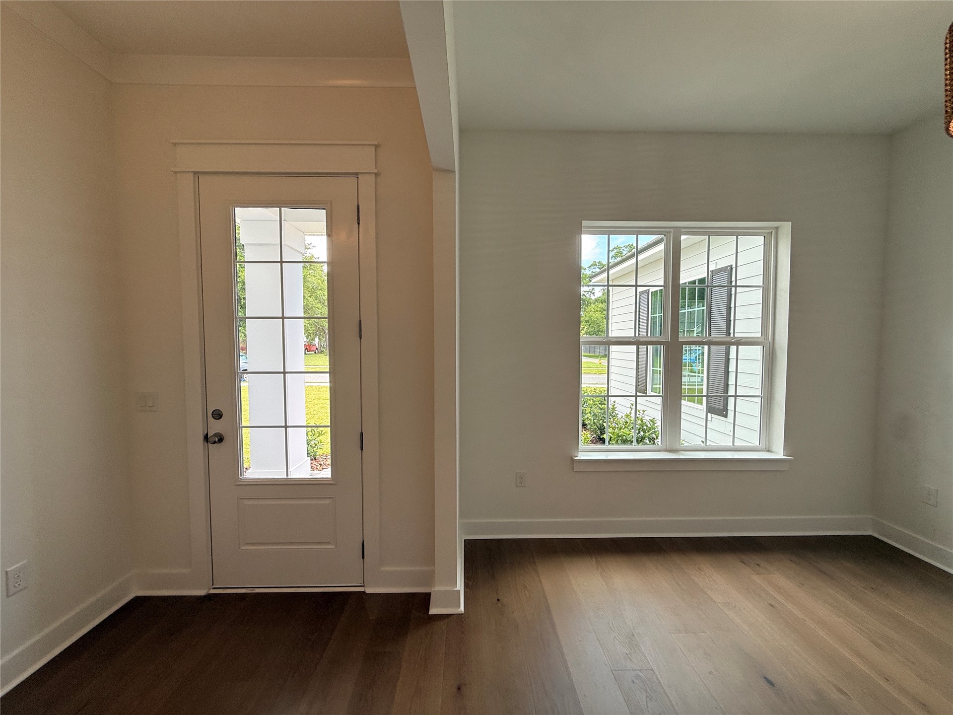 96130 Captains Pointe Road Yulee, FL 32097 - Photo 7 of 32 an empty room with wooden floor and windows