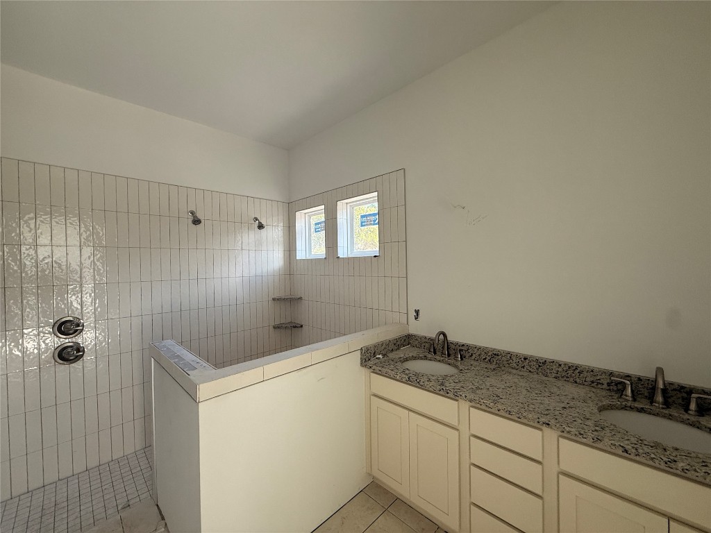 96130 Captains Pointe Road Yulee, FL 32097 - Photo 9 of 12 a bathroom with a granite countertop sink and a mirror