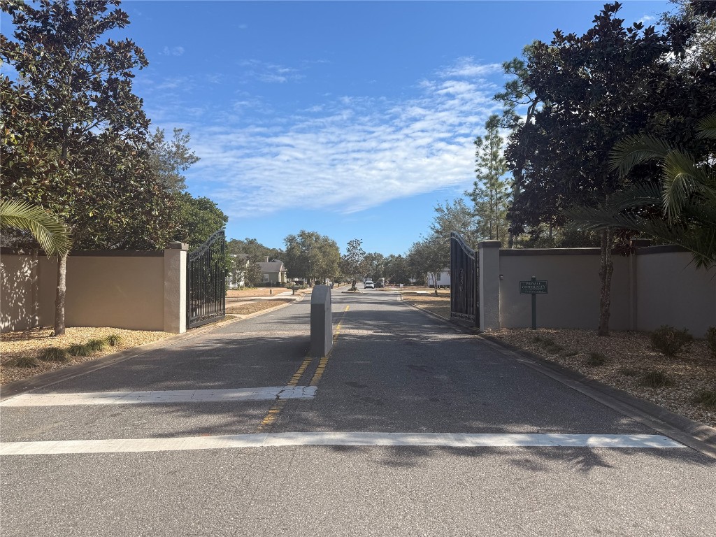 96130 Captains Pointe Road Yulee, FL 32097 - Photo 10 of 12 a backyard of a house with yard and garage