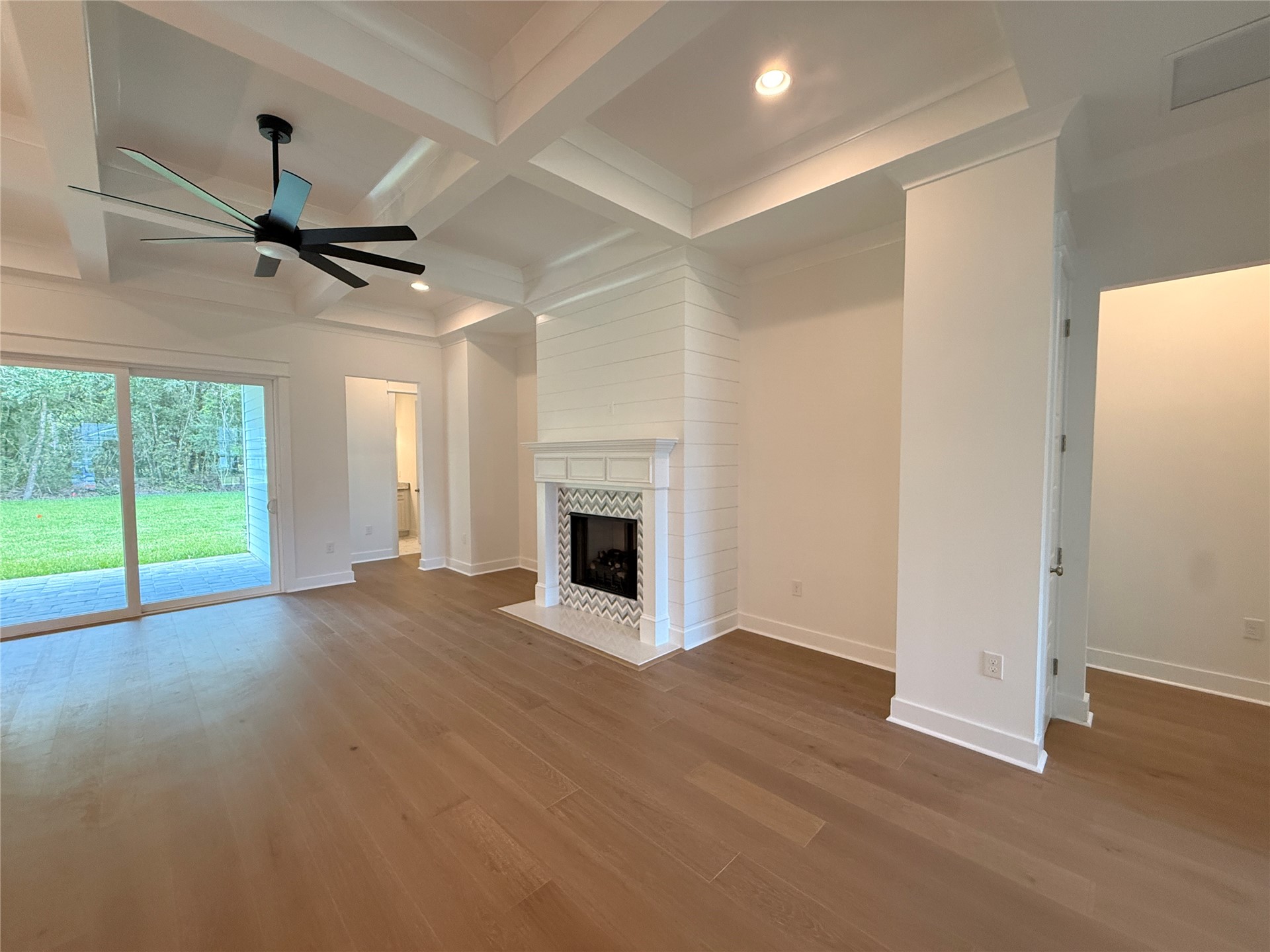 96130 Captains Pointe Road Yulee, FL 32097 - Photo 10 of 32 a view of an empty room with a fireplace and a window