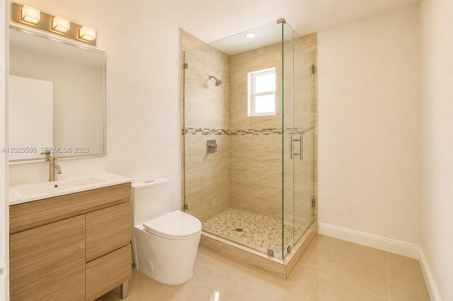 9421 Southwest 150th Street Miami, FL 33176 - Photo 18 of 31 a bathroom with a shower a toilet and a sink