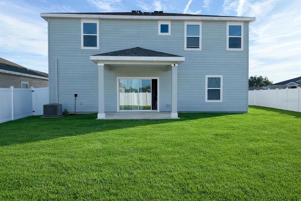4682 Southwest 83rd Loop Ocala, FL 34476 - Photo 3 of 3 a view of a house with yard and garden