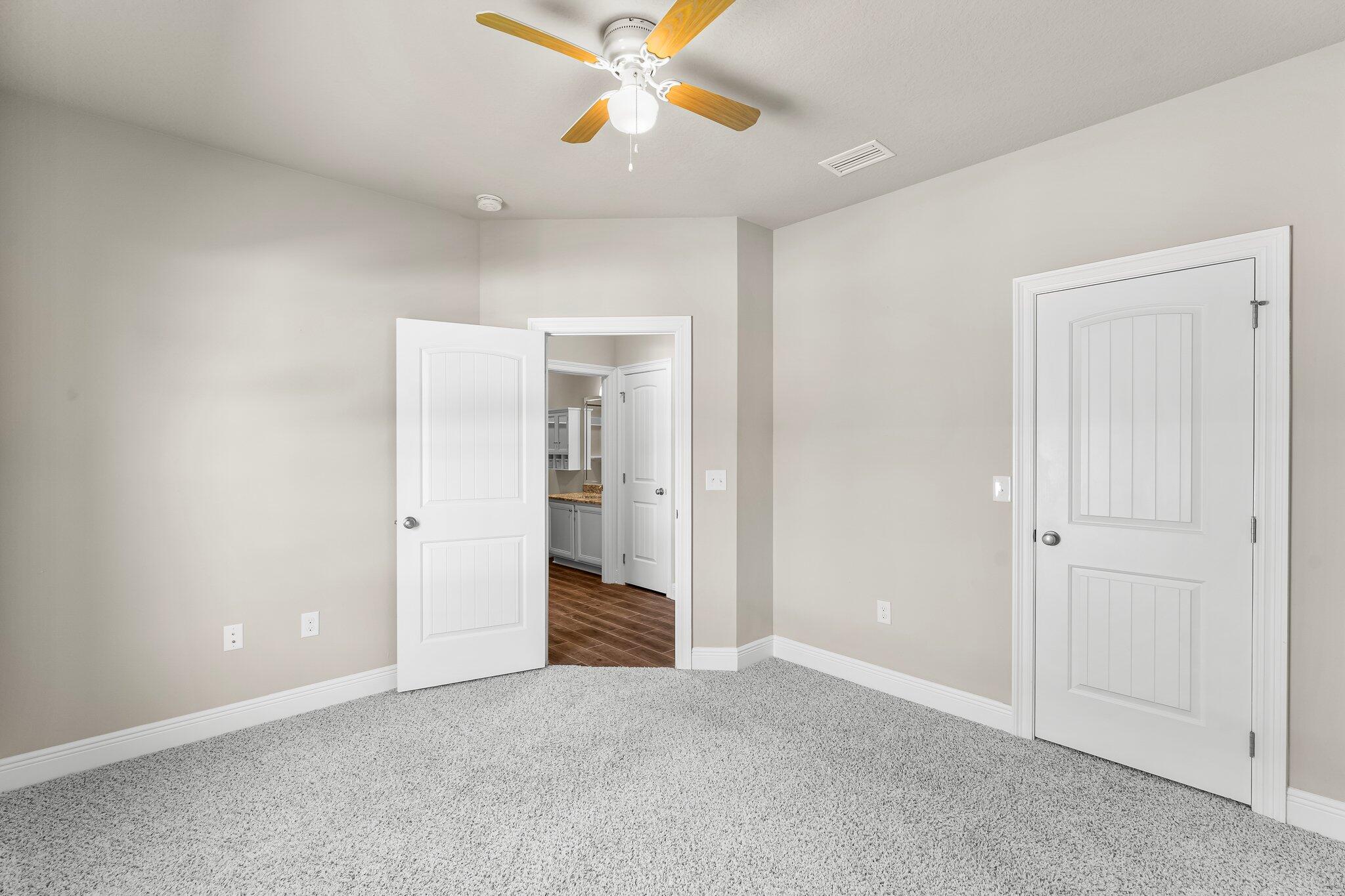 29 Buddy Lane Santa Rosa Beach, FL 32459 - Photo 12 of 47 an empty room with closet and fan