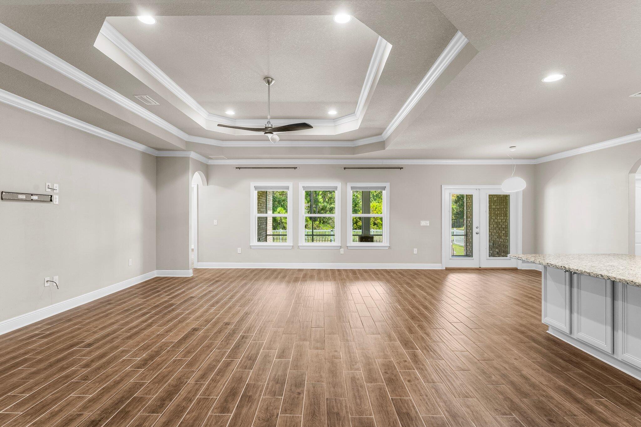 29 Buddy Lane Santa Rosa Beach, FL 32459 - Photo 16 of 47 a view of an empty room with wooden floor and a window