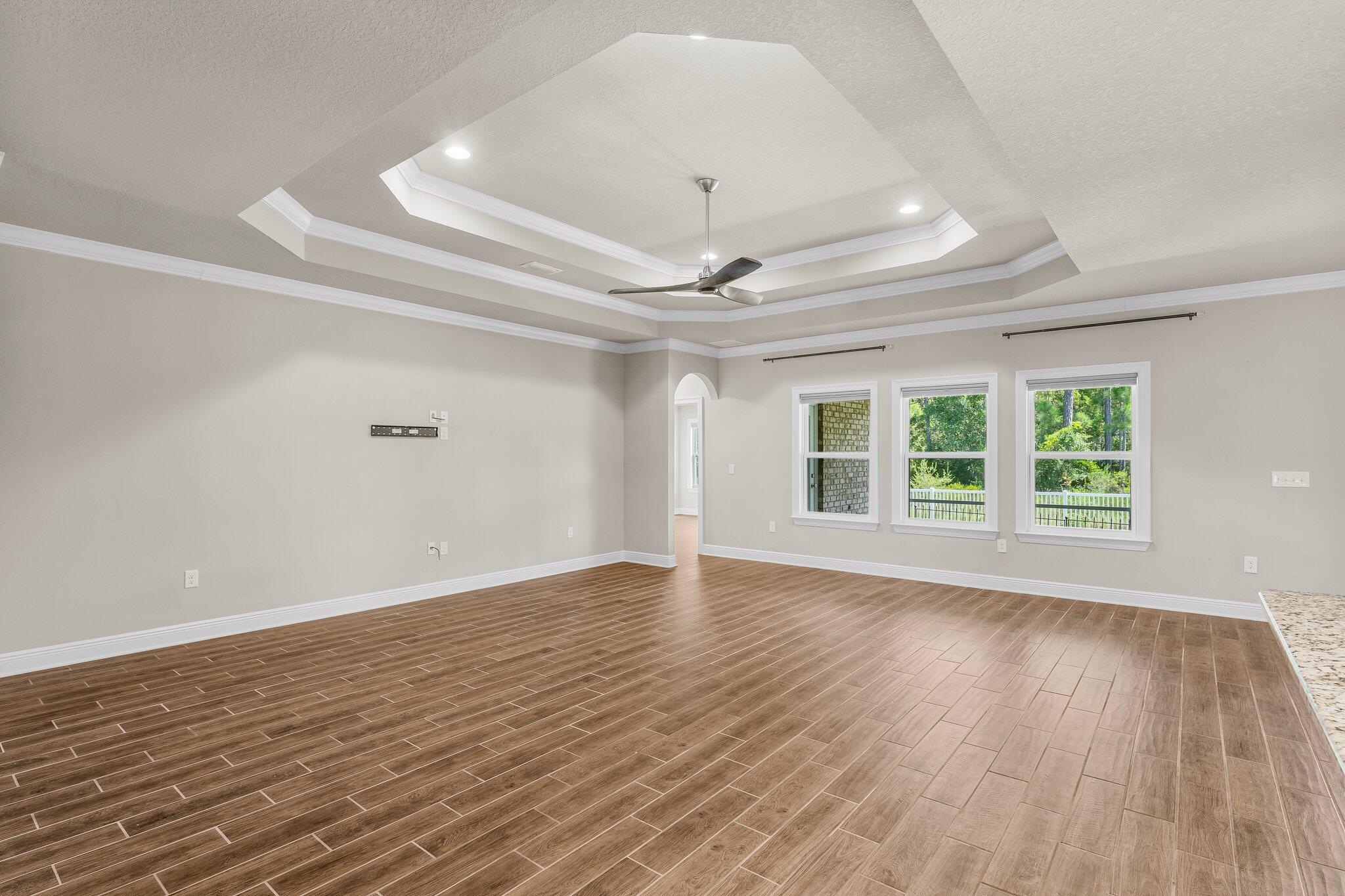 29 Buddy Lane Santa Rosa Beach, FL 32459 - Photo 17 of 47 a view of an empty room with wooden floor and a window