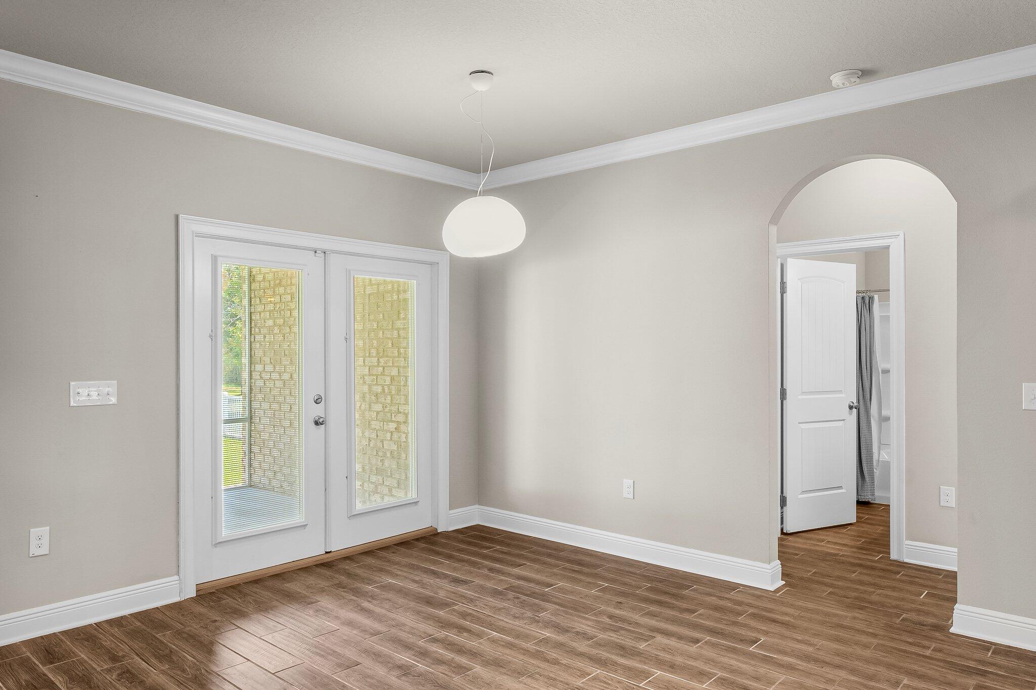 29 Buddy Lane Santa Rosa Beach, FL 32459 - Photo 20 of 47 an empty room with wooden floor and windows